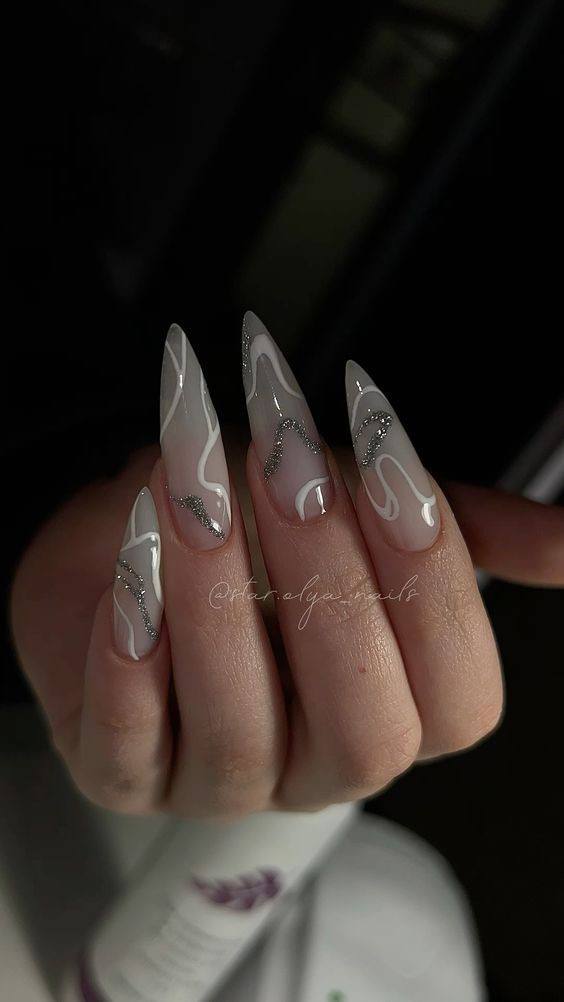 Nude Stiletto Nails with Silver and White Swirls: Elegant Style Guide