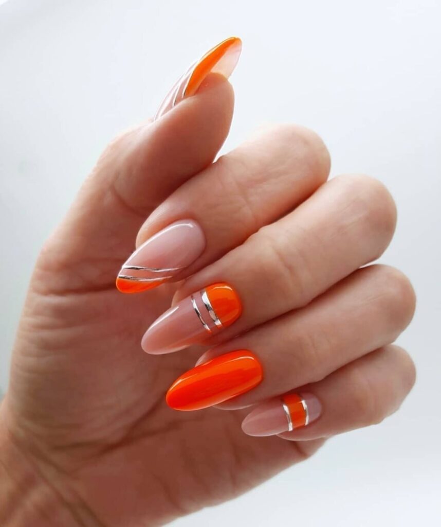 Vibrant Orange & Silver Swirl Nails: A Radiant Summer Manicure